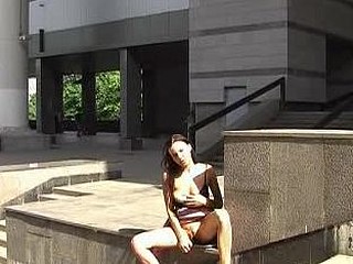 Bare-titted chick sex-toying in public